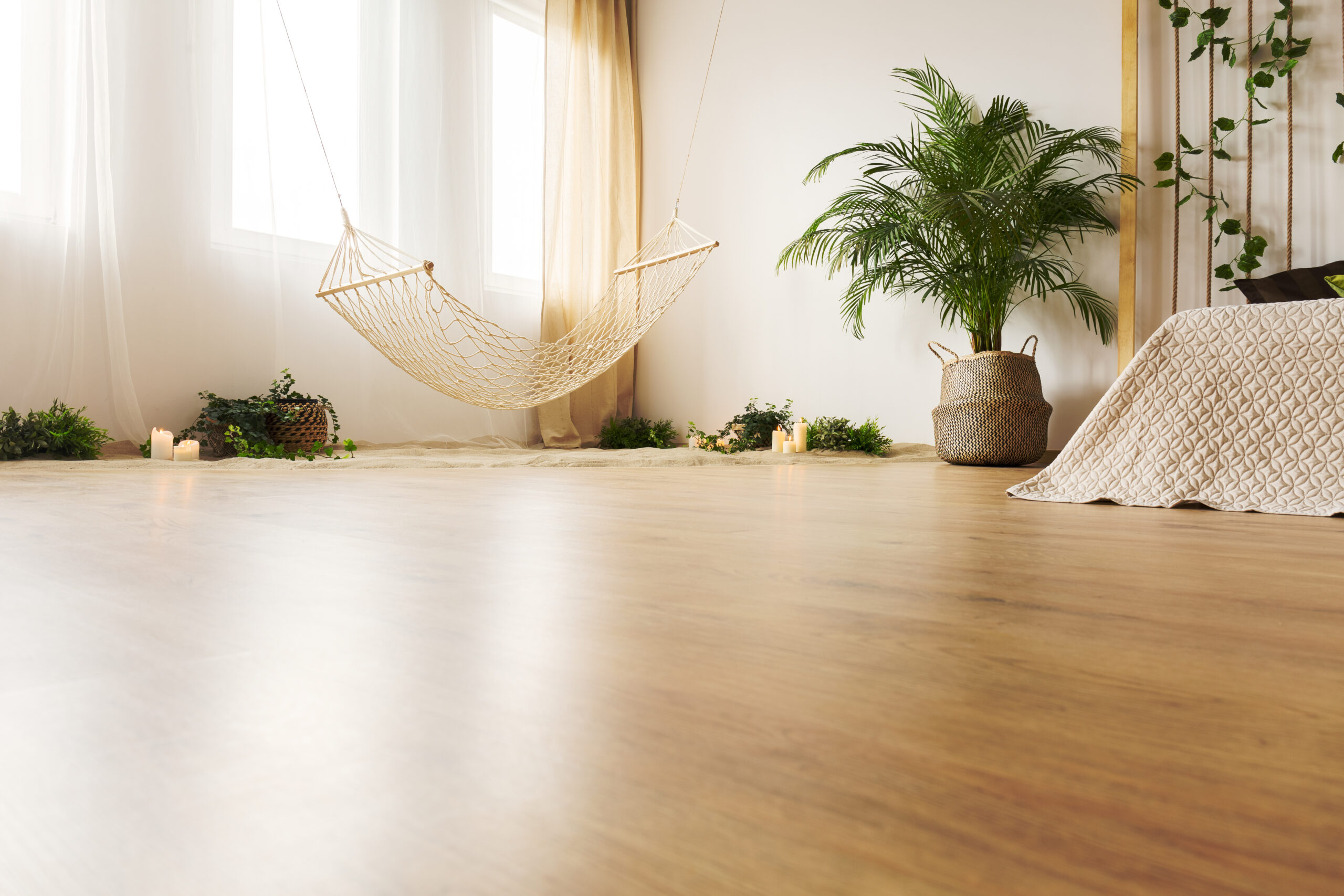 Bedroom with hardwood floor, bed and hammock