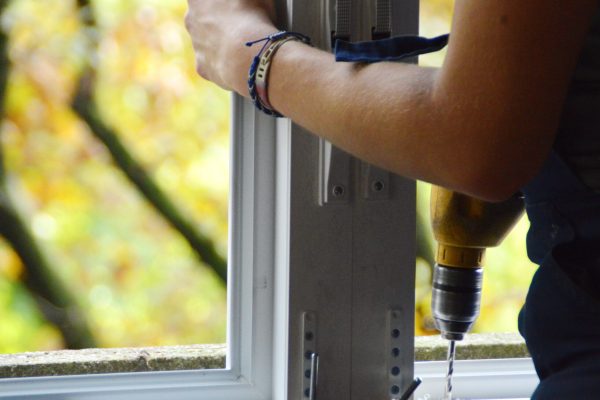 man-s-hands-fixing-the-window-with-drill-2025-03-10-15-27-10-utc